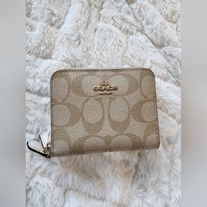 COACH Zippered Bifold, Signature Canvas in Cream/Beige